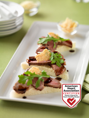 beef crostini with balsamic drizzle and parmesan crisps recipe image