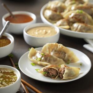 beef pot stickers with quartet of dipping sauces recipe image