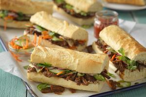 gochujang beef banh mi sandwiches with whipped beef liver pate and pickled vegetables recipe image