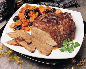 beef brisket with savory carrots and dried plums recipe image