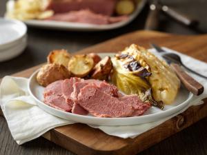 dijon-glazed corned beef with savory cabbage and red potatoes recipe image