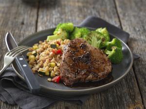 sweet & spicy petite sirloin steaks with vegetable barley risotto recipe image