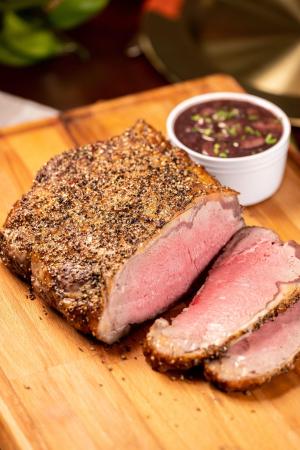 green peppercorn crusted strip roast with red wine sauce recipe image