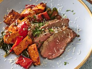roasted sun-dried tomato beef tri-tip with peppers and sweet potatoes recipe image