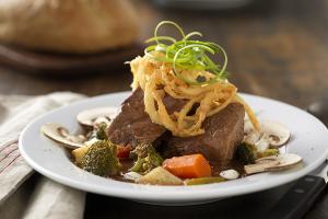 slow-cooked beef pot roast soup with roasted vegetables and lemon crema recipe image