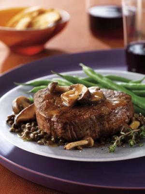 filet mignon with herb-butter sauce and mushrooms recipe image