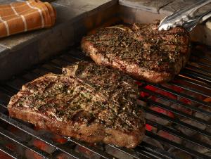 grilled porterhouse steaks with garlic-herb peppercorn crust recipe image