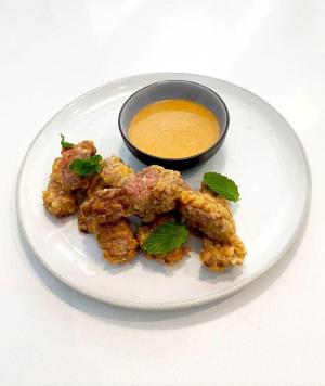 country-fried strip steak bites with hot sauce white gravy recipe image