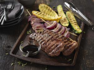 beef strip steaks with balsamic grilled vegetables recipe image