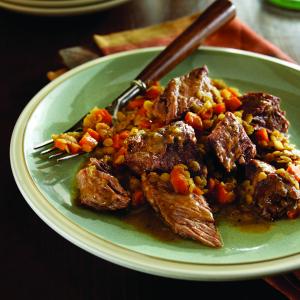 braised chuck steaks with savory lentils recipe image