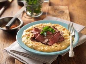 cajun-style steak and grits recipe image