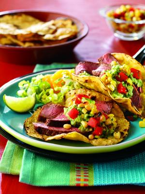 cumin seasoned steaks with spicy grilled corn salsa recipe image