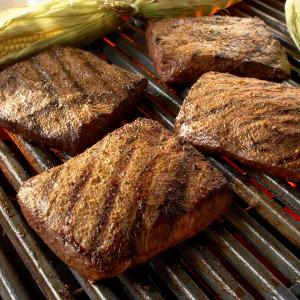 flat iron steaks with grilled corn and cumin-lime butter recipe image