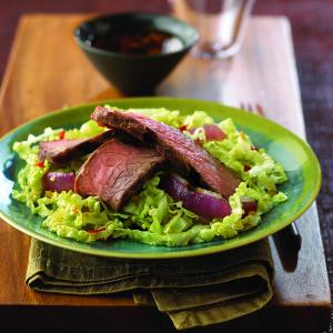 ginger-maple steak with napa cabbage & grilled onions recipe image