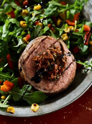 grilled beef flank pinwheels on rocket salad recipe image