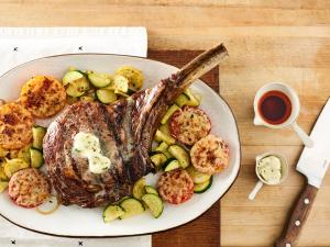 grilled beef ribeye steak with parmesan tomatoes and squash recipe image