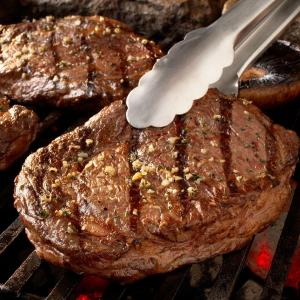 Ribeye steaks with blue cheese butter and mushrooms recipe image