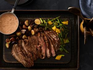 six-chile beef flank steak with southwest tomato cream and roasted vegetables recipe image