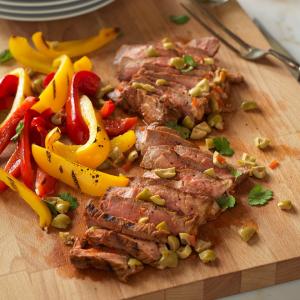 spanish-style grilled steaks with olives recipe image