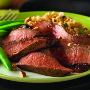 turkish-style sirloin with roasted garlic-fig sauce recipe image