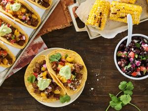 ancho chile spiced street tacos with pineapple salsa and jalapeño crema recipe image